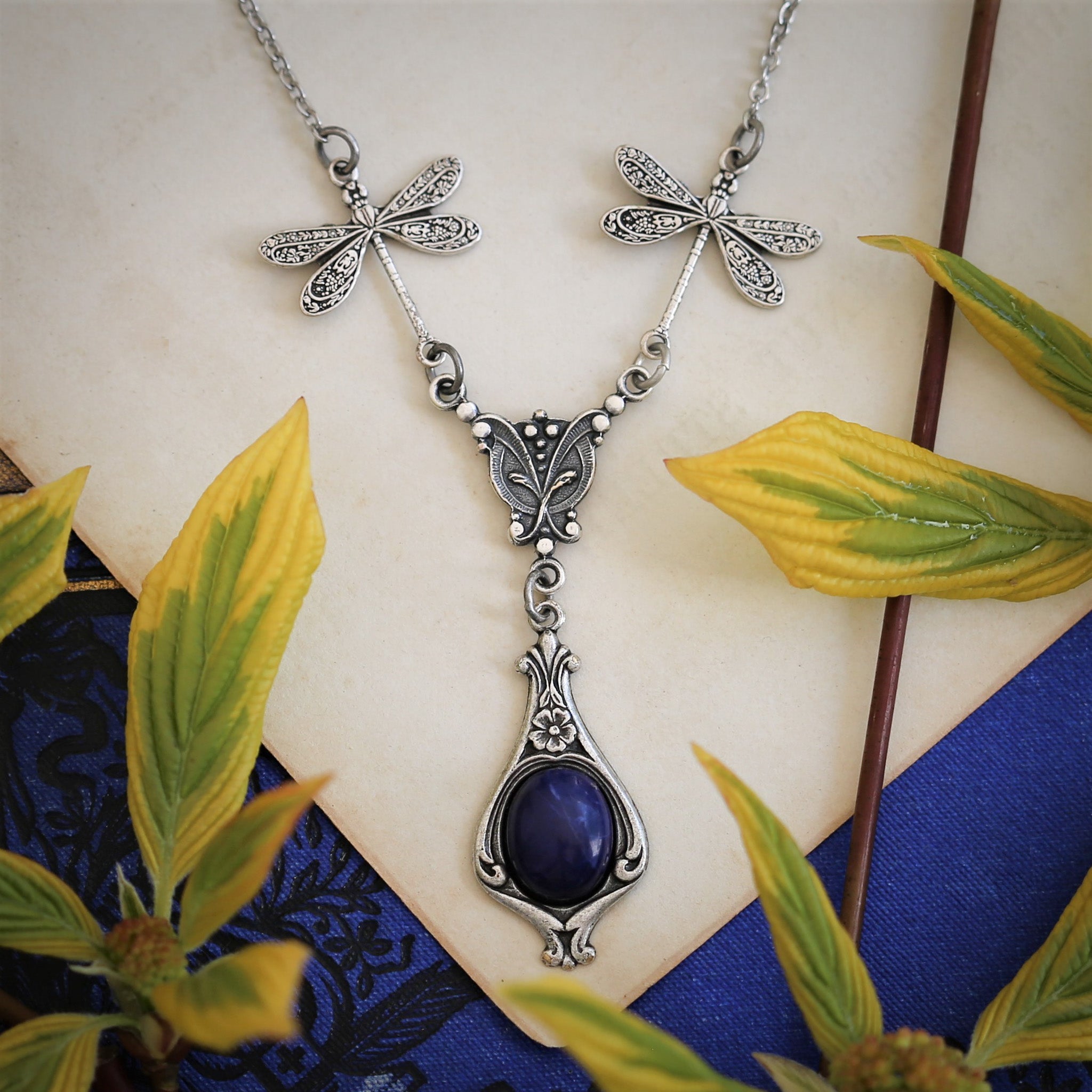 antiqued silver vintage-style dragonfly simple drop semi-precious stone mineral dark blue howlite pendant in winter academia aesthetic