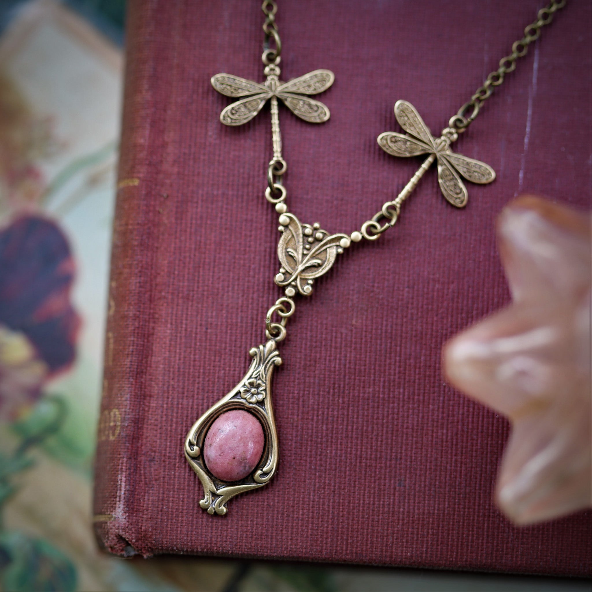 antiqued brass vintage-style dragonfly simple drop semi-precious rock mineral pink rhodonite pendant in princess core aesthetic