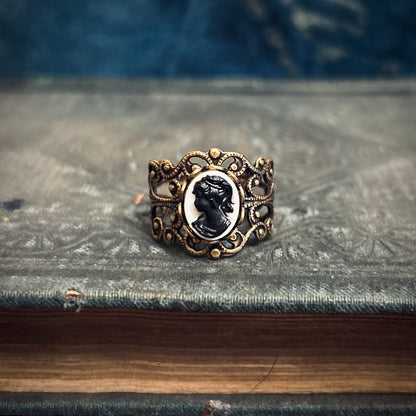 Antiqued brass adjustable filigree ring with black and white lady cameo