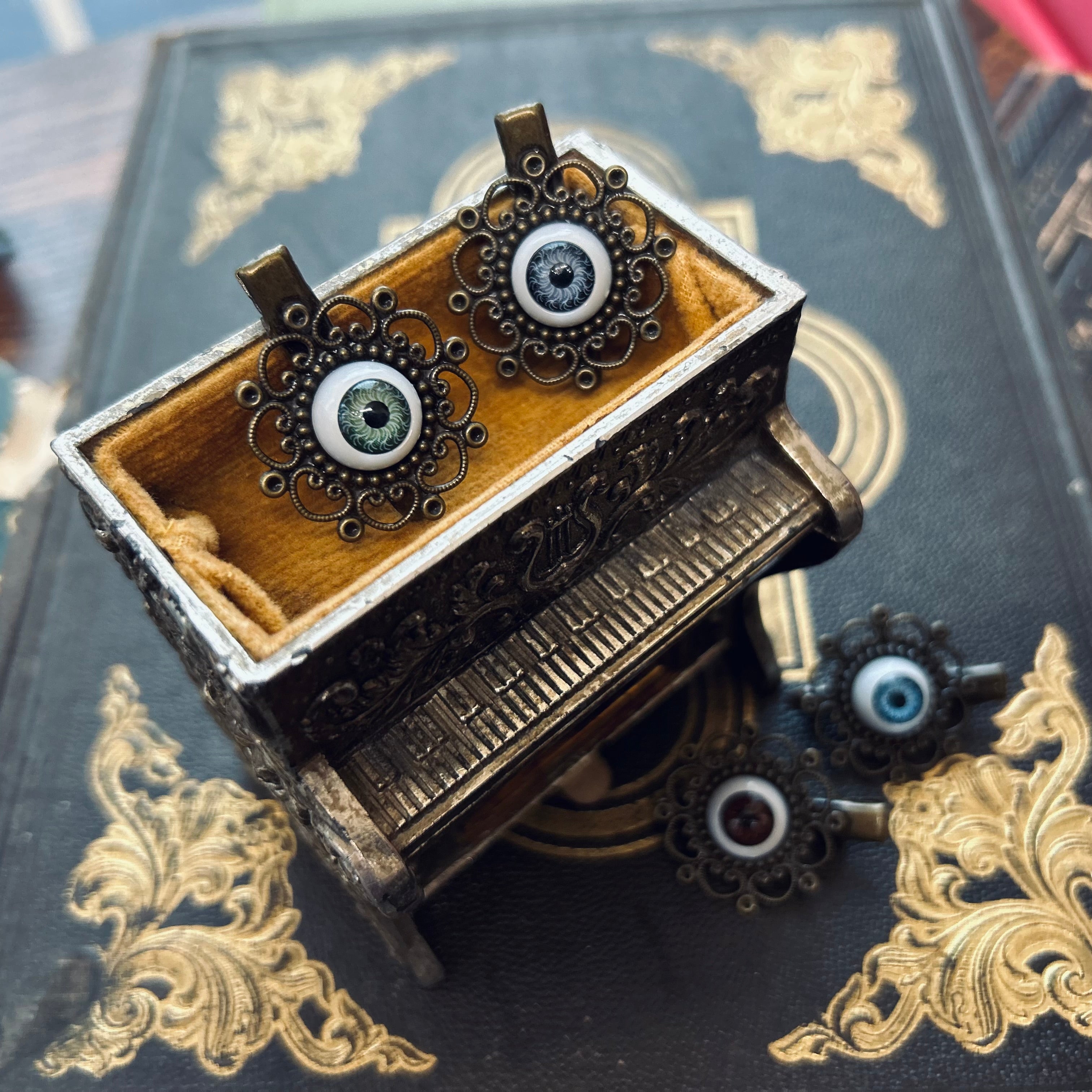 antiqued brass filigree eyeball hair clips in goblincore style