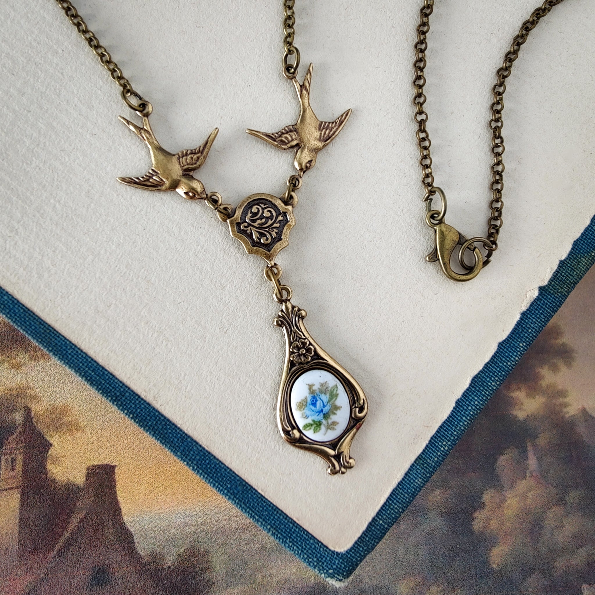 Antiqued bird Victorian style necklace with vintage rose teardrop ceramic cameo pendant.