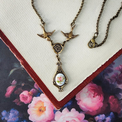 Antiqued bird Victorian style necklace with vintage rose teardrop ceramic cameo pendant.