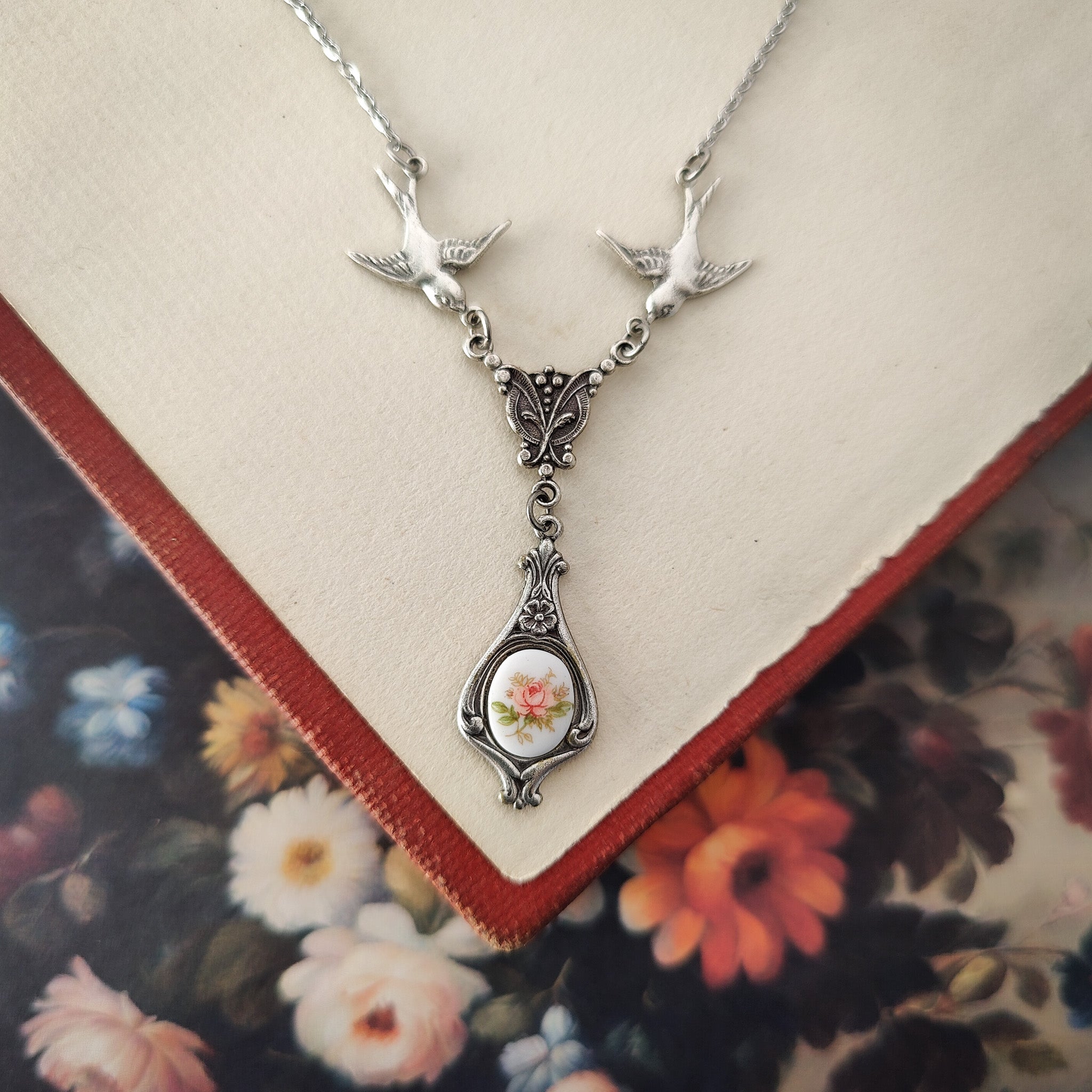 Antiqued bird Victorian style necklace with vintage rose teardrop ceramic cameo pendant.