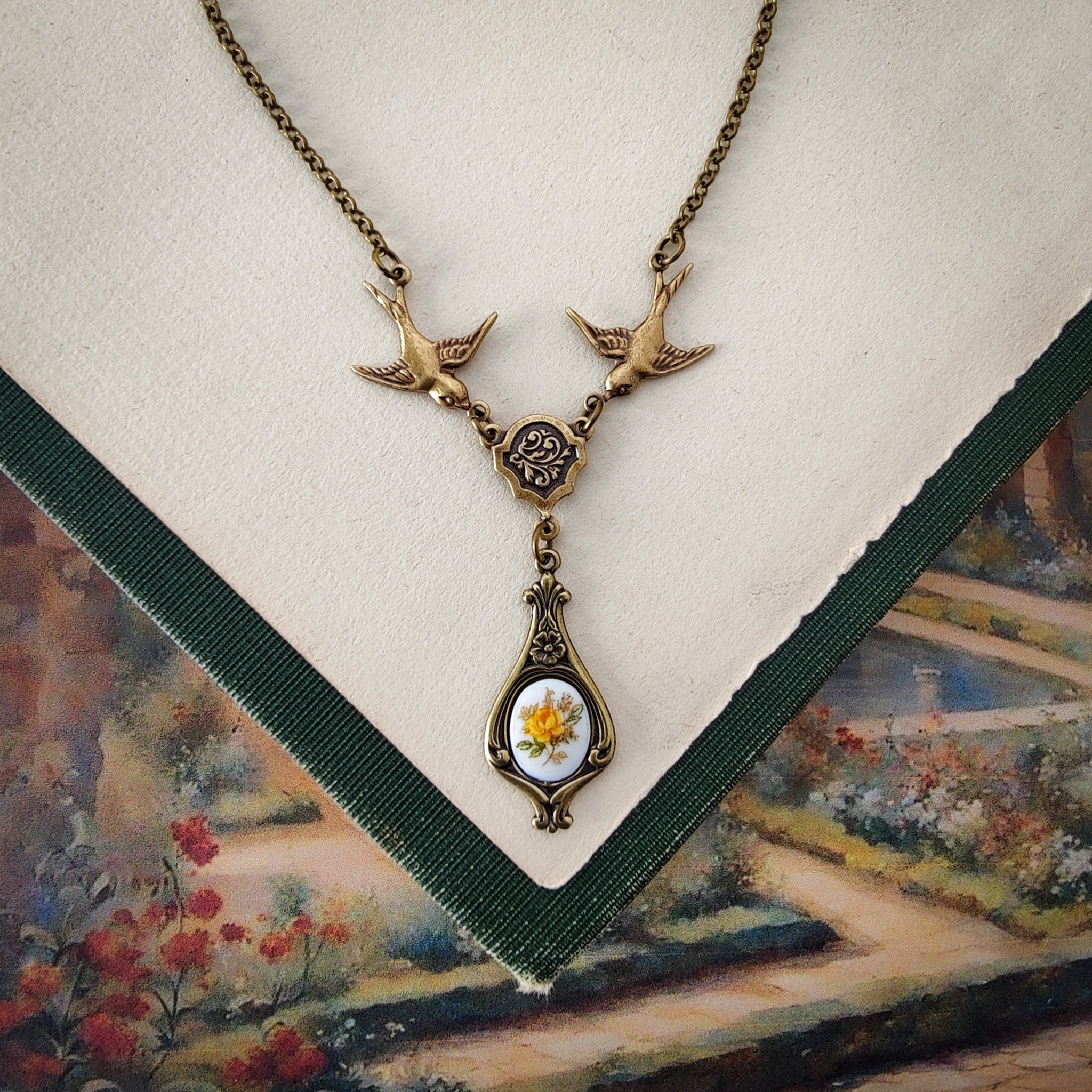 Antiqued bird Victorian style necklace with vintage rose teardrop ceramic cameo pendant.