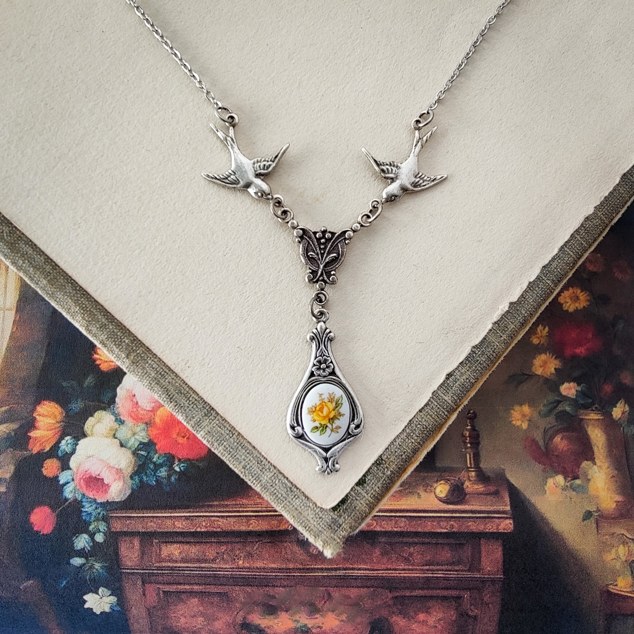 Antiqued bird Victorian style necklace with vintage rose teardrop ceramic cameo pendant.