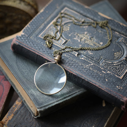 antiqued brass modern vintage inspired long monocle pendant necklace making a great teacher gift