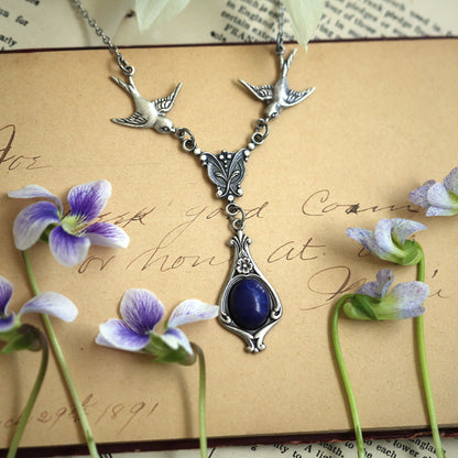 antiqued silver vintage-style deep blue howlite stone drop pendant with birds in dark nautical style