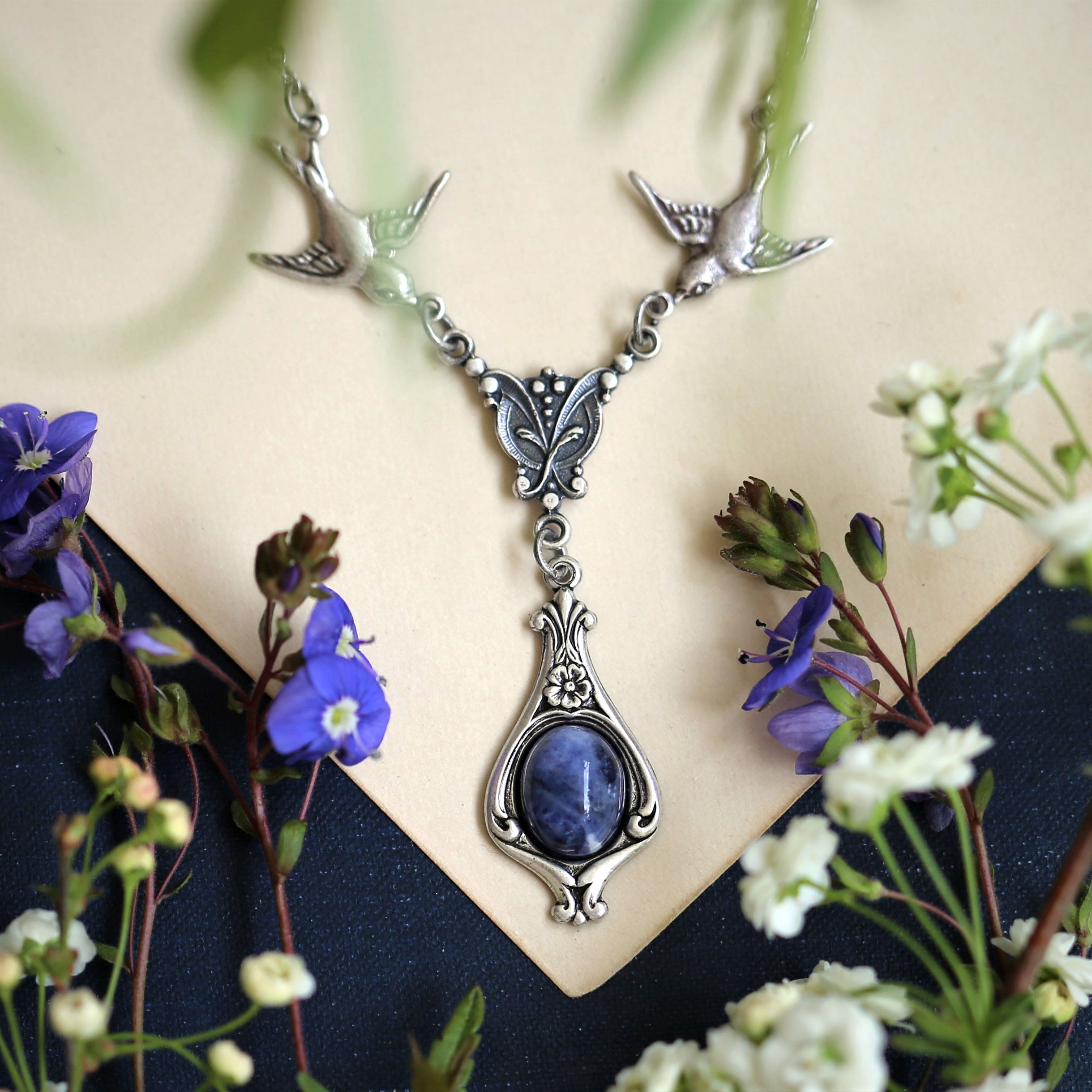 small antiqued silver vintage-style blue  sodalite stone drop pendant with birds in winter academia style