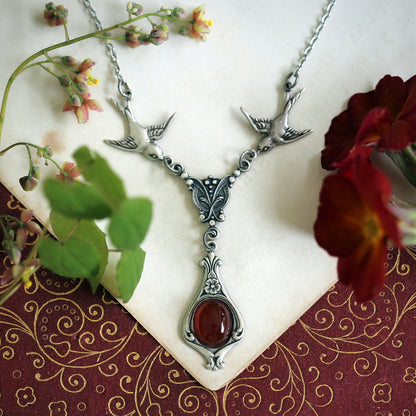 Antiqued silver vintage-style orange carnelian drop pendant featuring birds in cottage core style fall wedding gift.