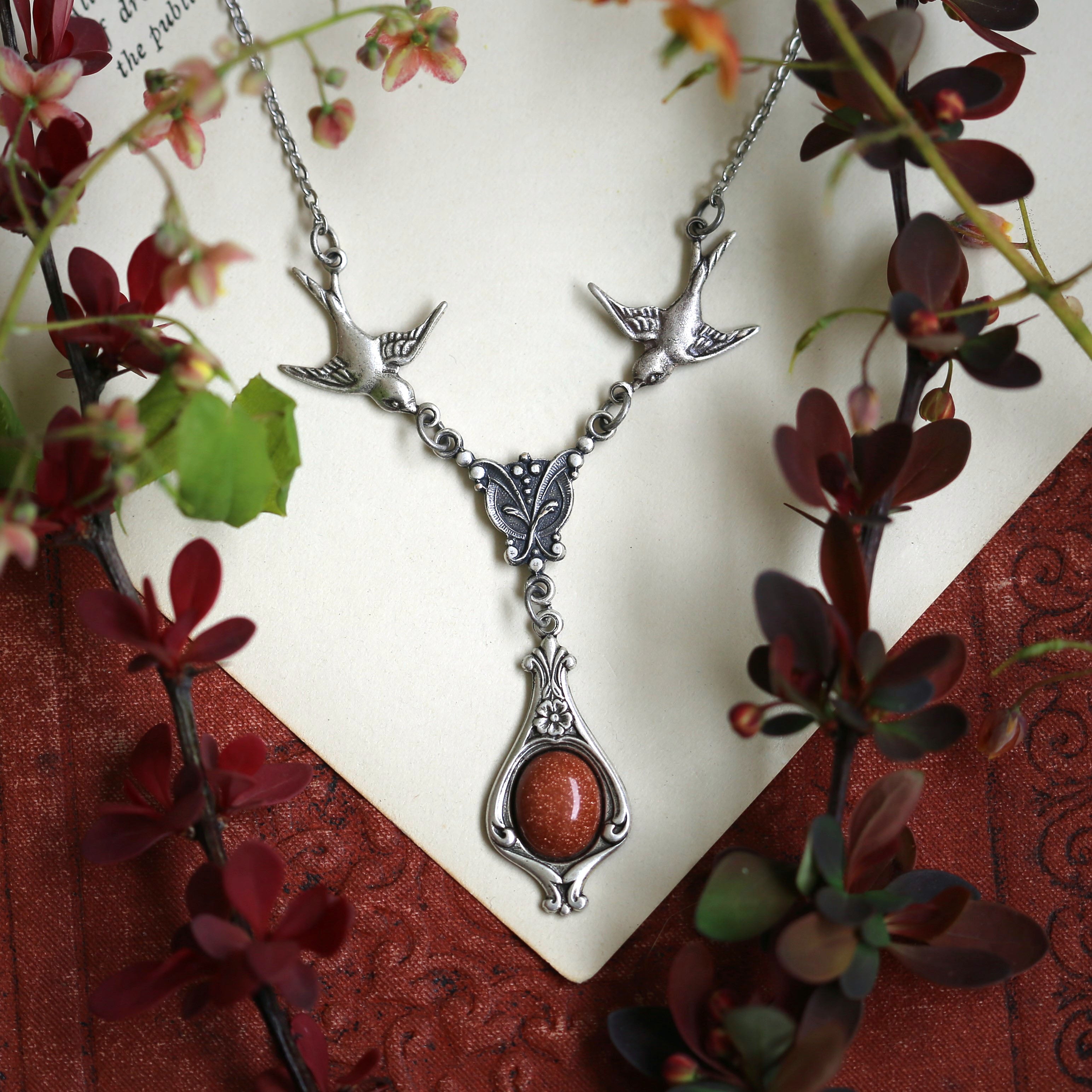 Antiqued silver vintage-style orange sunstone drop pendant featuring birds in autumn academia style gift.