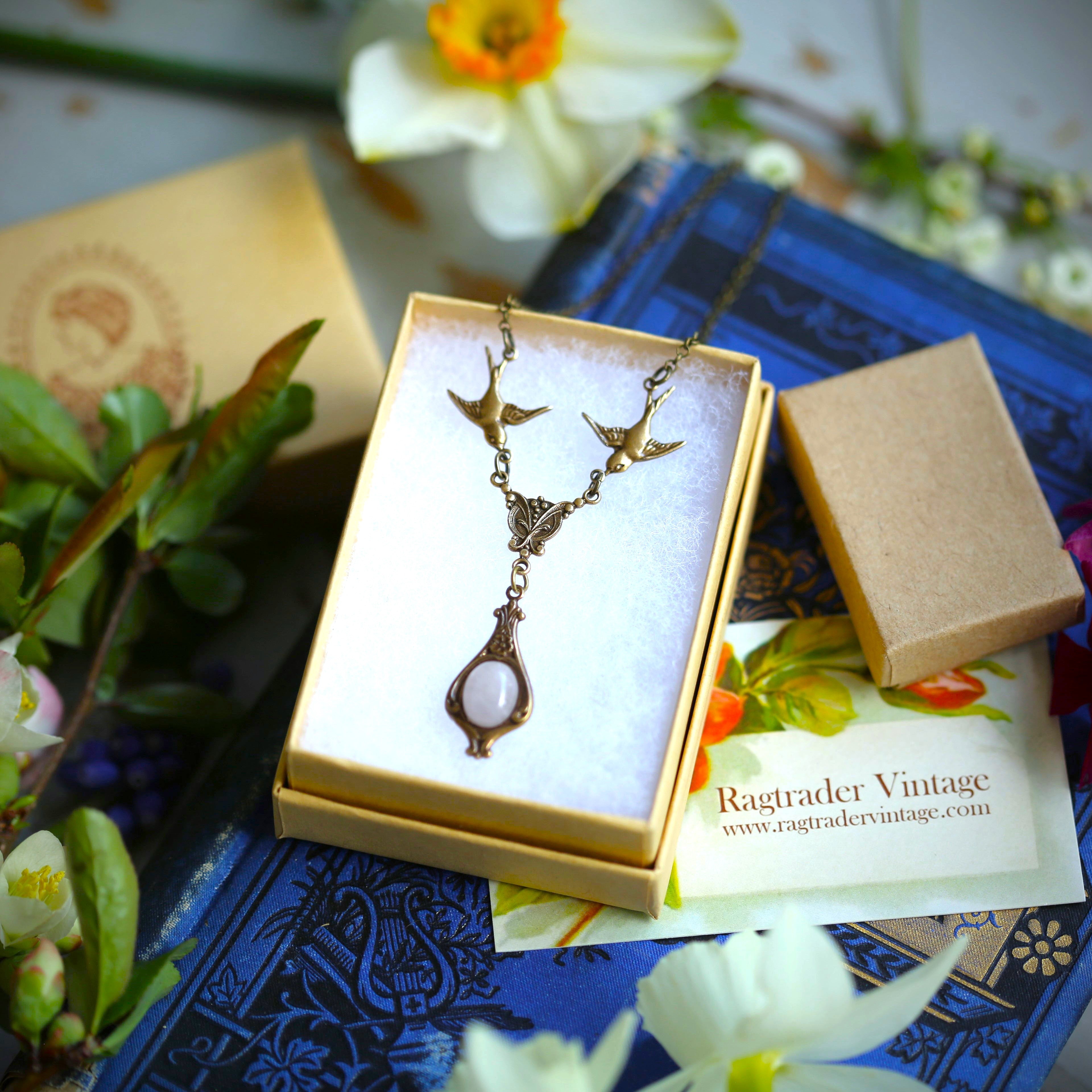 small antiqued brass vintage-style pink rose quartz stone drop pendant with birds in pastel academia style in gift box