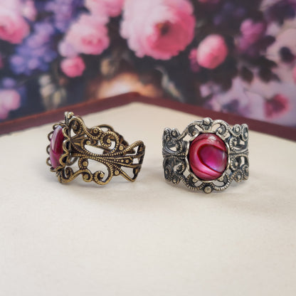 antiqued silver modern vintage inspired adjustable statement filigree ring with a rich rose pink paua oval shell in the pink pastel goth aesthetic