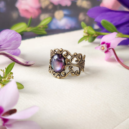 antiqued brass modern vintage inspired fully adjustable brass filigree band ring with an oval purple shell in the vibrant Academica style