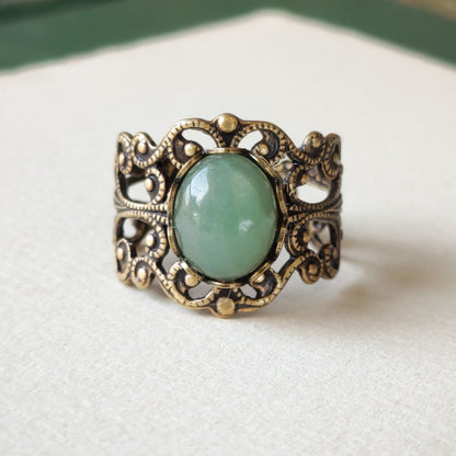 Antiqued brass modern vintage inspired adjustable filigree cocktail ring with a green aventurine semi-precious stone in the prairie core style.  