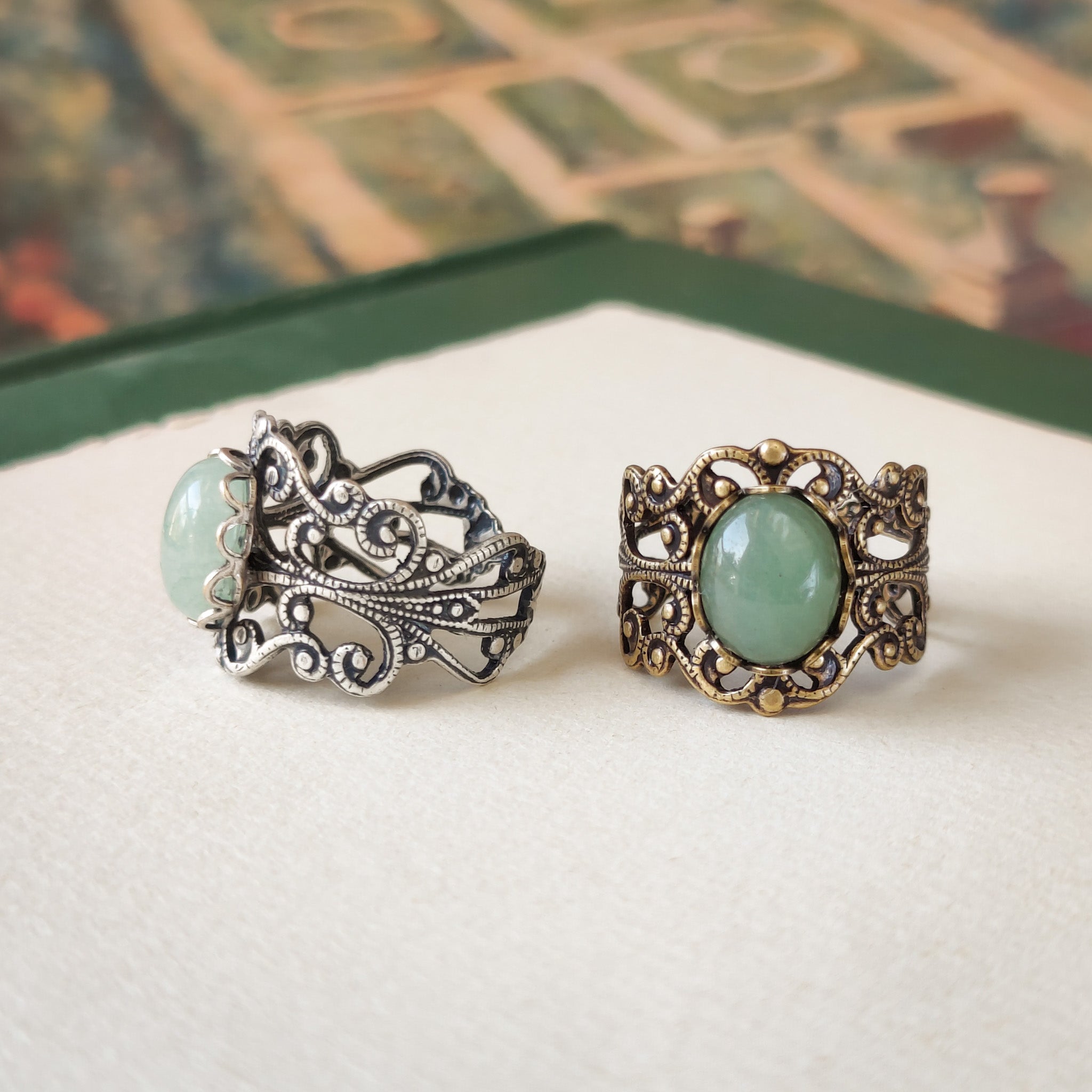 Antiqued brass modern vintage inspired adjustable filigree cocktail ring with a green aventurine semi-precious stone in the light academia style