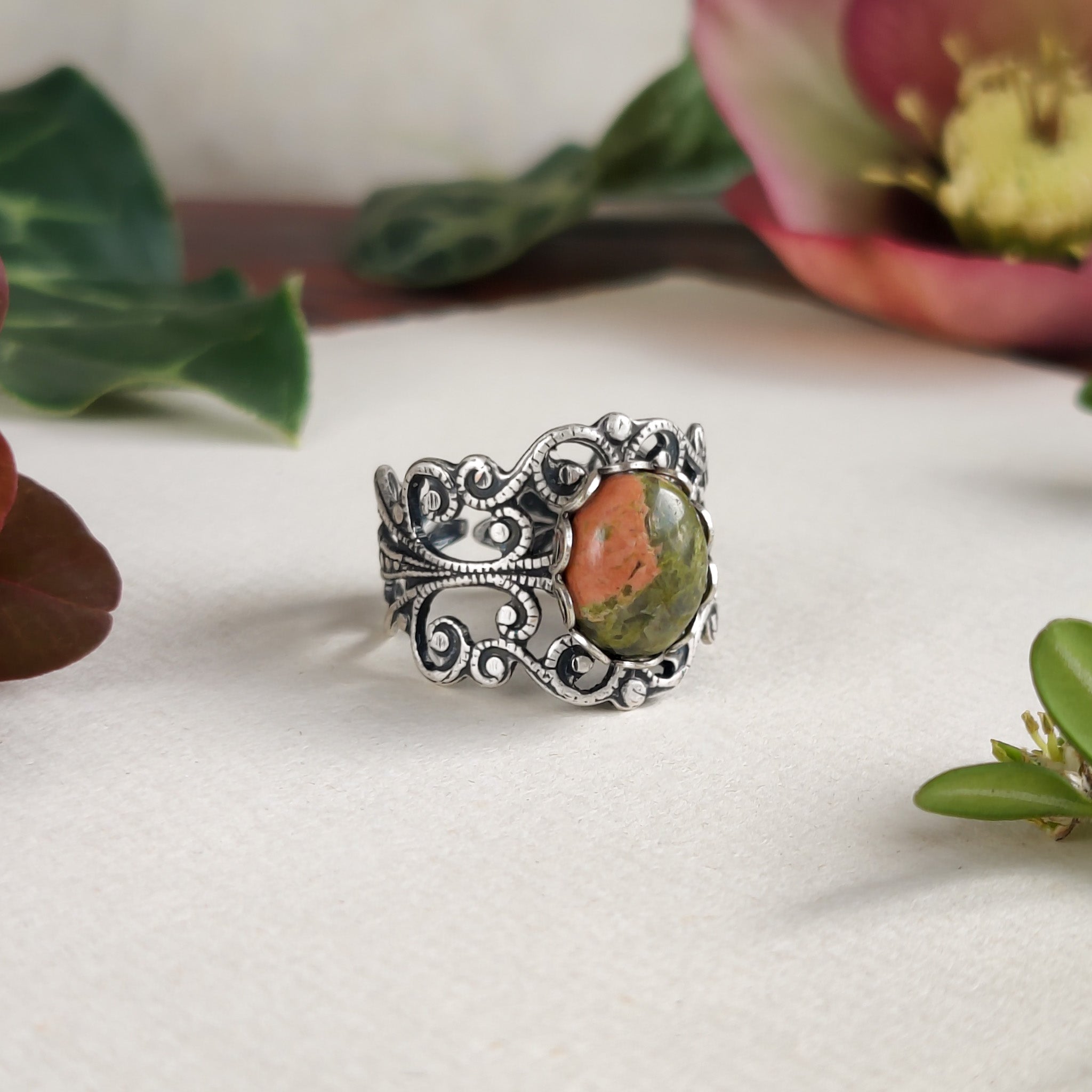 Antiqued silver modern vintage inspired adjustable filigree cocktail ring with orange and green unakite semi-precious stone oval mineral in a indie aesthetic