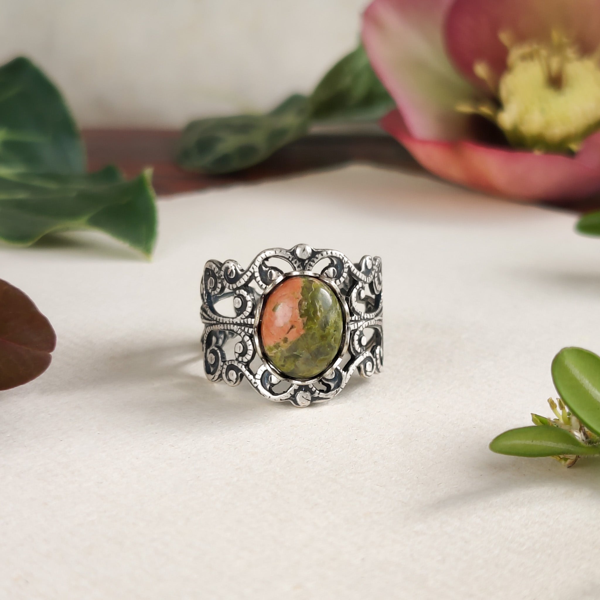 Antiqued silver modern vintage inspired adjustable filigree cocktail ring with orange and green unakite semi-precious stone oval mineral in a hippie aesthetic