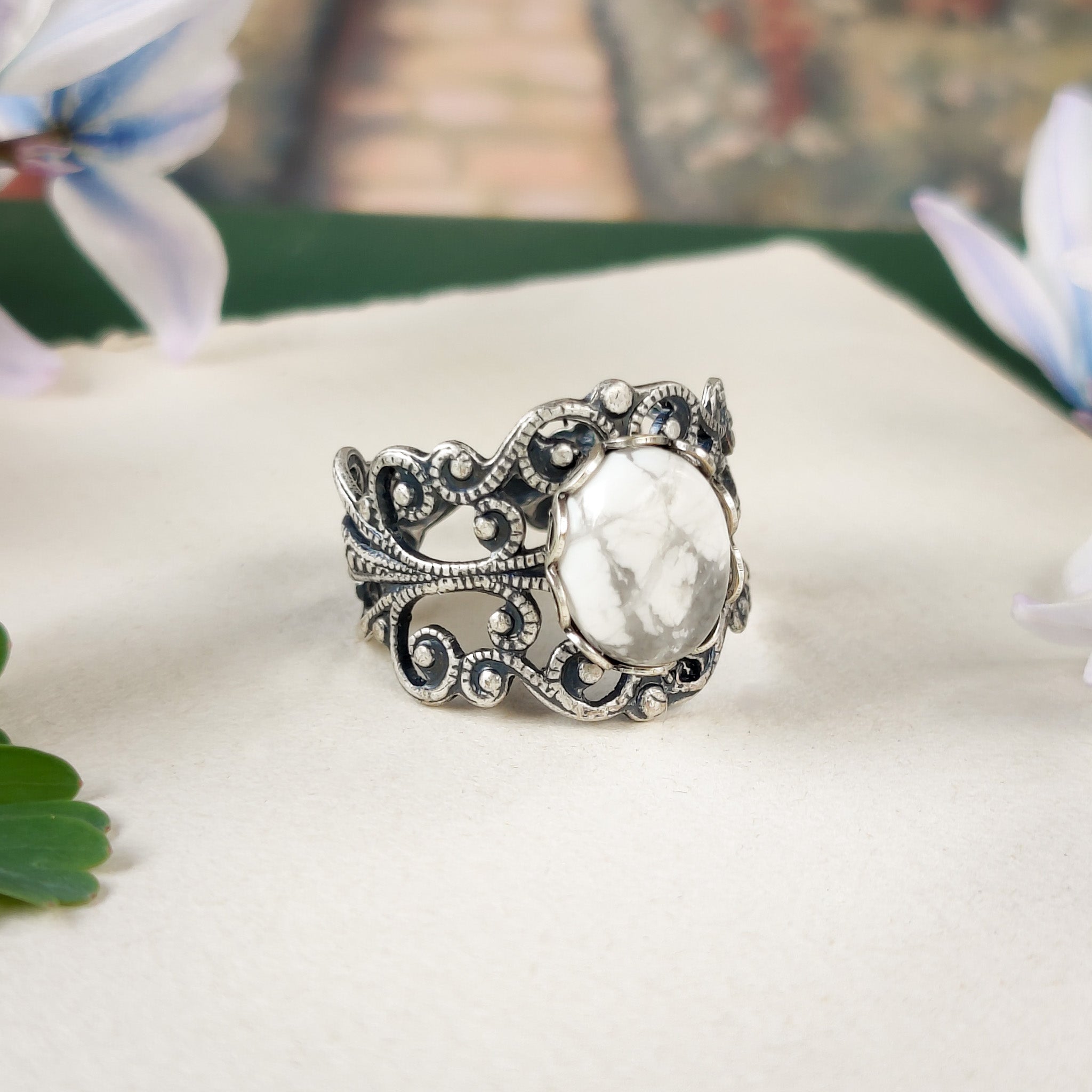 antiqued silver colored modern vintage inspired adjustable filigree ring with a white marble howlite semi-precious mineral oval stone in the medieval goth aesthetic
