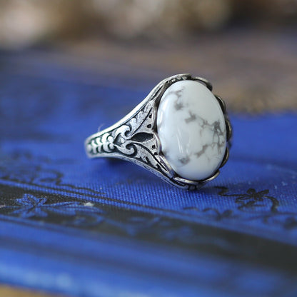 Antiqued silver vintage adjustable filigree oakleaf ring with a white howlite oval stone.