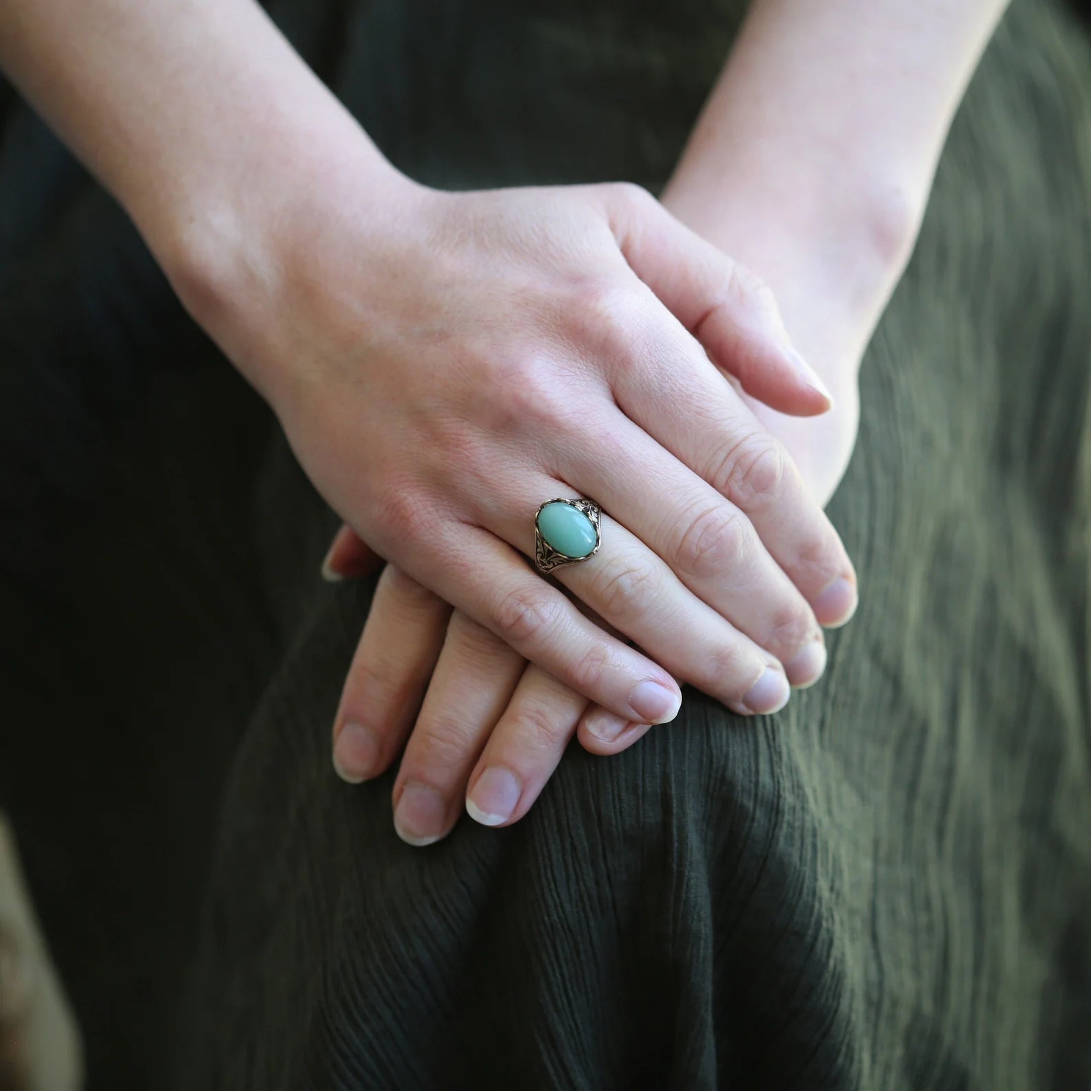 antiqued brass vintage style adjustable green aventurine gardencore, mosscore, woodlandcore, or cottage core statement ring modeled with green dress