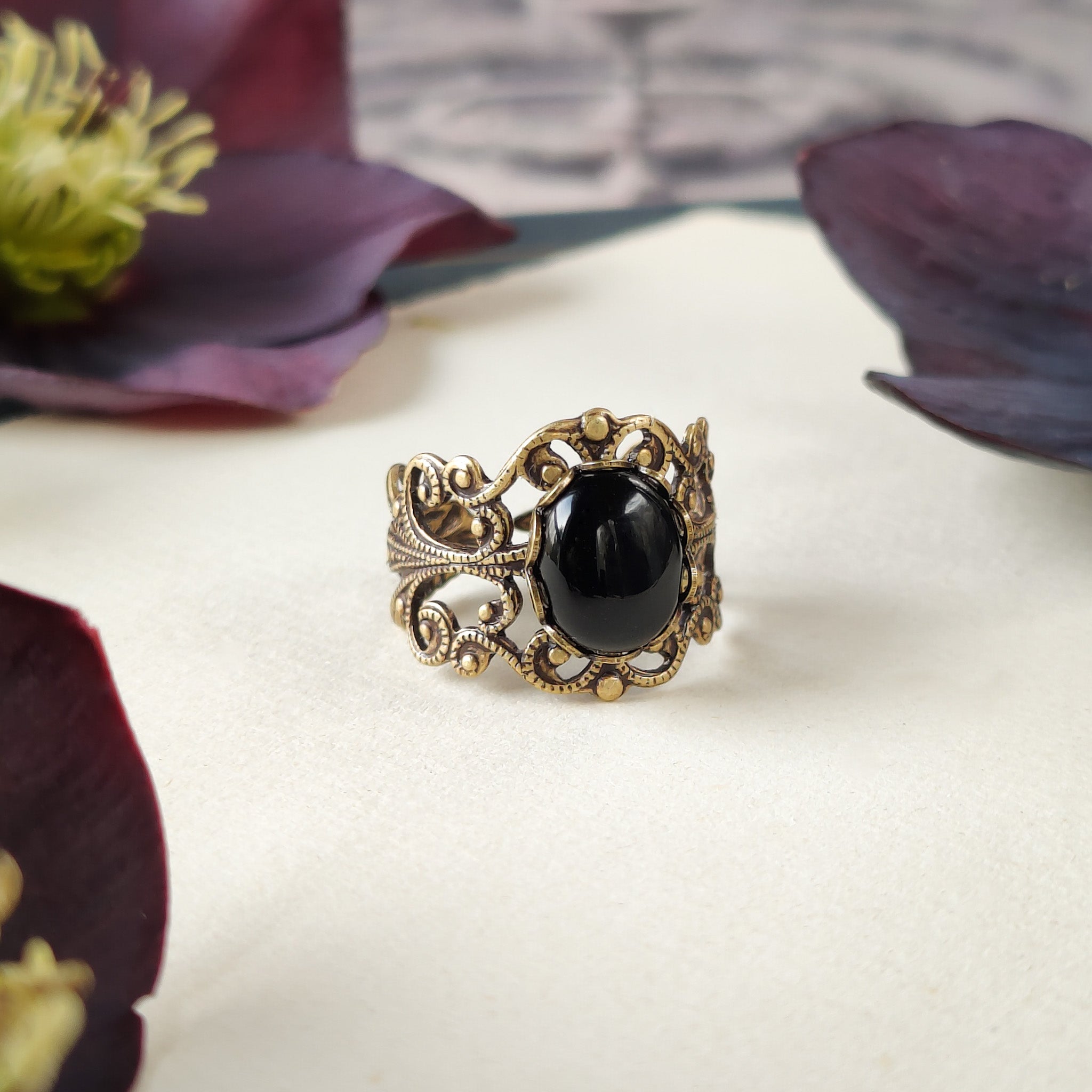 Antiqued brass modern vintage inspired adjustable filigree statement ring with a black oval onyx semi-precious stone mineral cabochon in southern gothic style