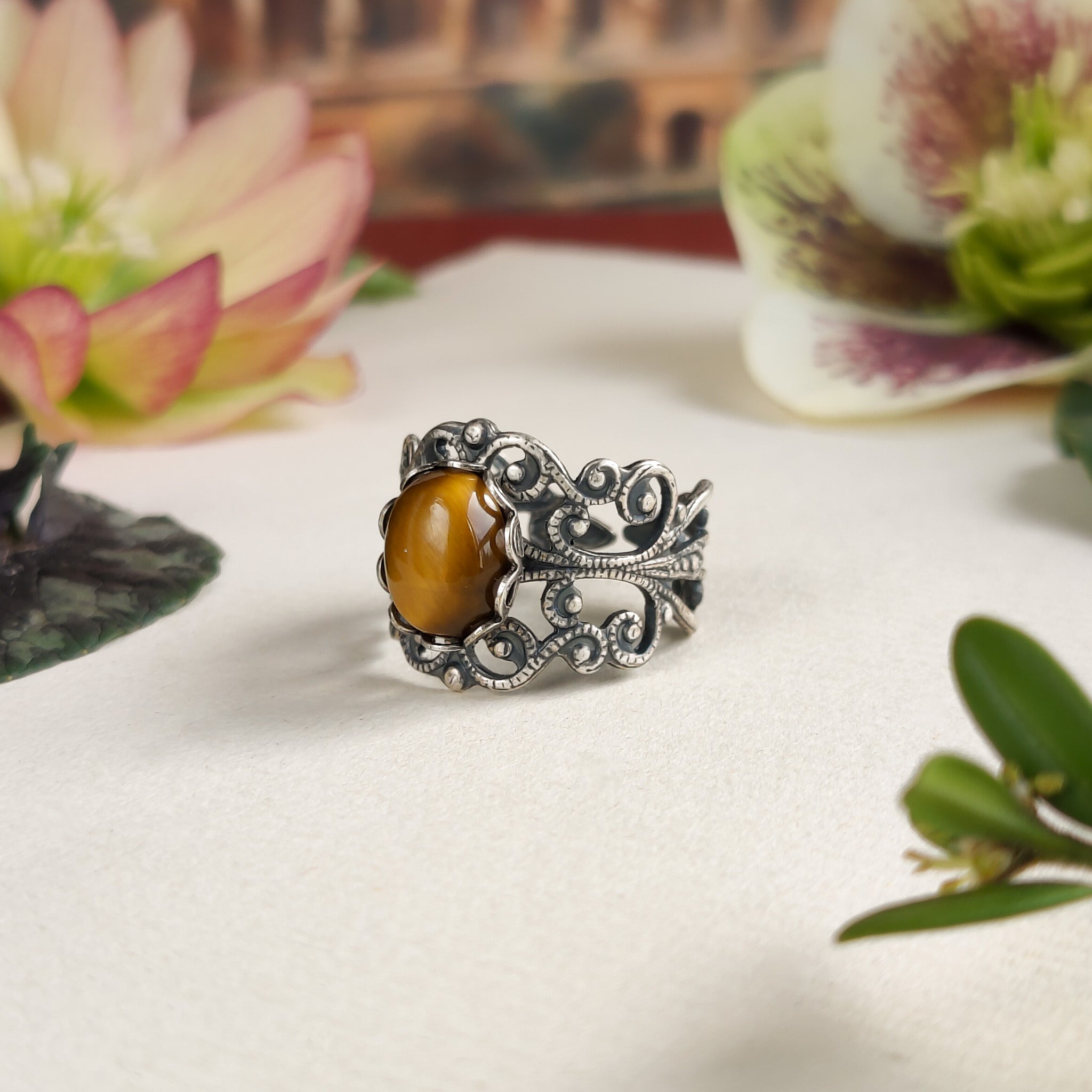 antiqued brass mod vintage inspired adjustable filigree ring with brown oval tiger eye semi-precious stone mineral perfect for a romantic academia outfit.