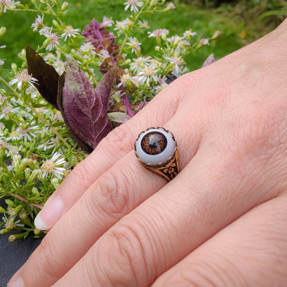 antiqued brass victorian gothic adjustable vintage-inspired zombie everyday ring with a brown doll's evil eye.