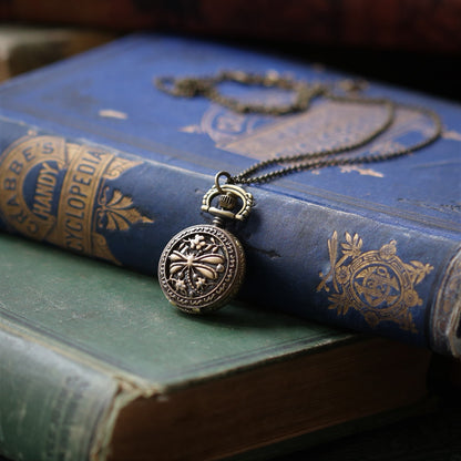 antiuqed brass wearable pocket watch necklace with dragonfly. Battery operated.