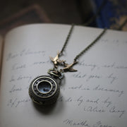 Stars and Pinwheels Battery Operated Pocket Watch Necklace in Antiqued Brass