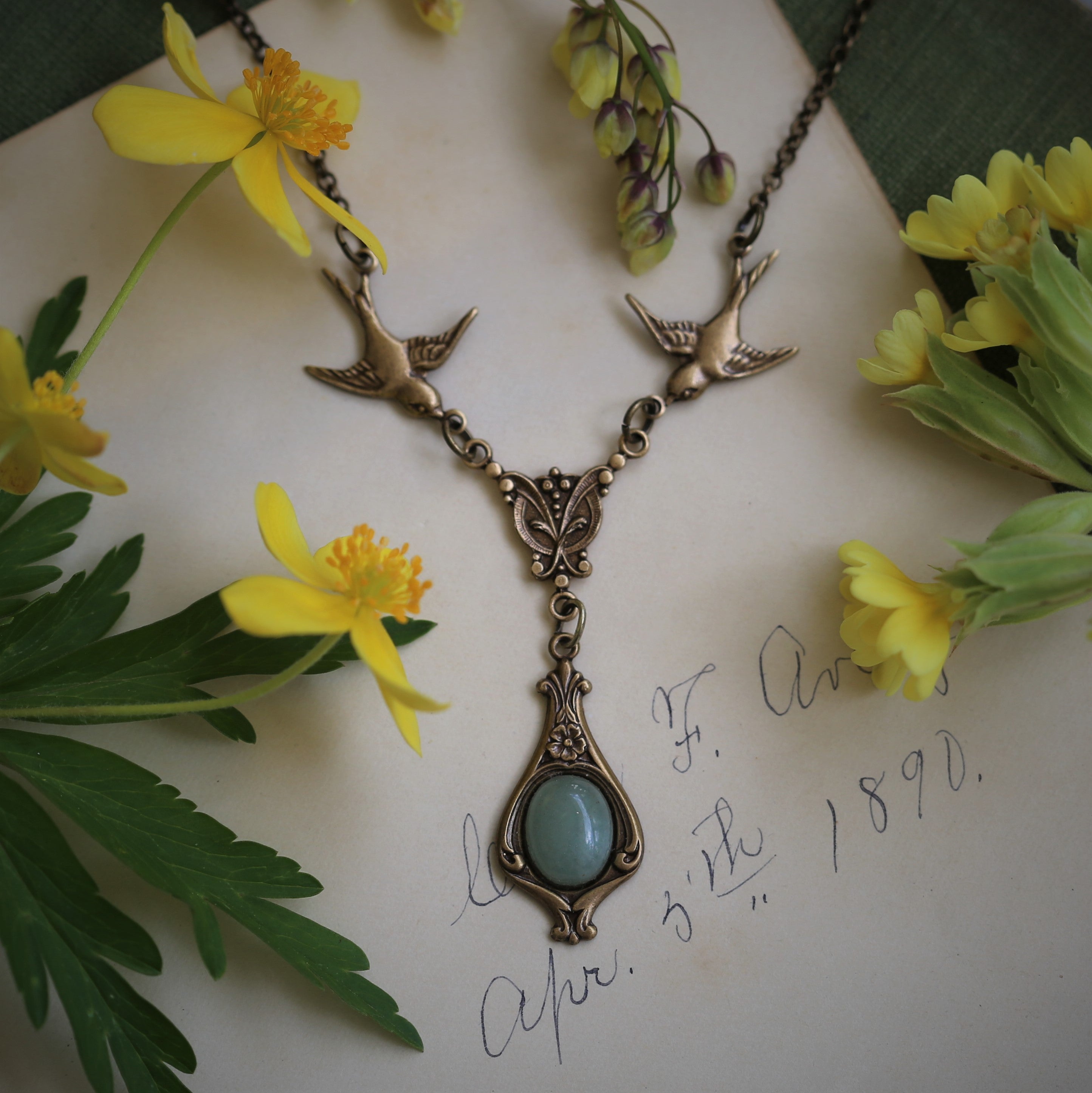 Antiuqed brass victorian vintage style bird necklace with an oval aventurine stone drop by ragtrader vintage.