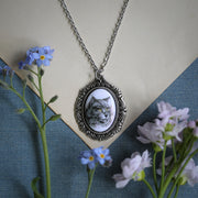 Long haired grey cat cameo set on an antiqued siver necklace made by ragtrader vintage.  Great pet owner gift.