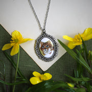 Antiqued silver vintage style orange cat cameo necklace by ragtrader jewelry