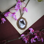 Black and white tabby cat cameo set on a antiqued brass necklace by ragtrader vintage.