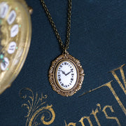 Antiqued Brass Clock face cameo necklace in vintage style.  Retro jewelry, classic academia
