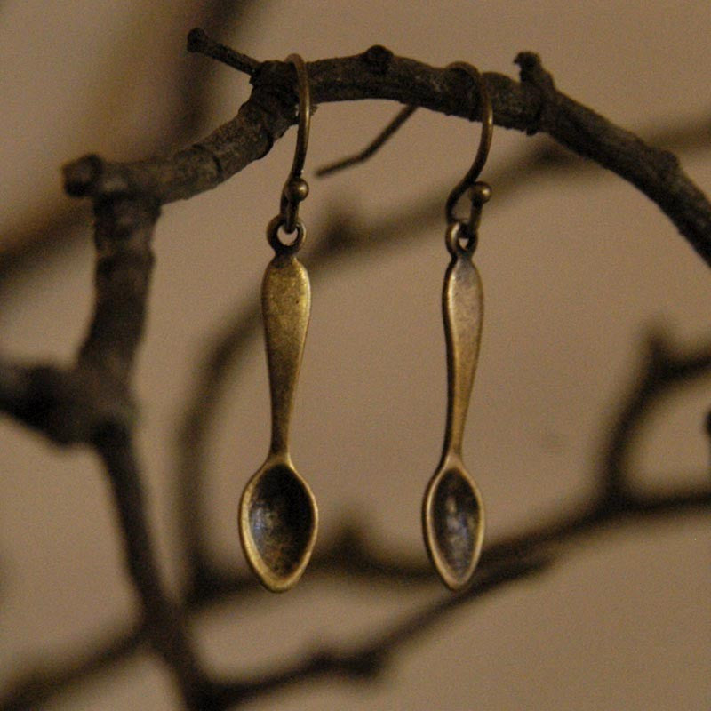 A pair of brass teaspoon dangle earrings.