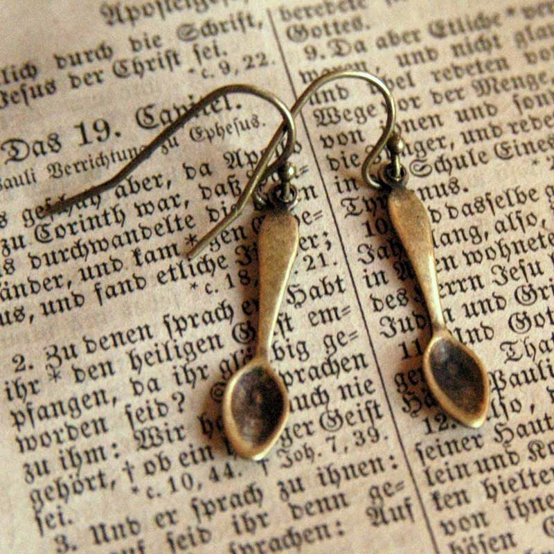 A pair of brass teaspoon dangle earrings.