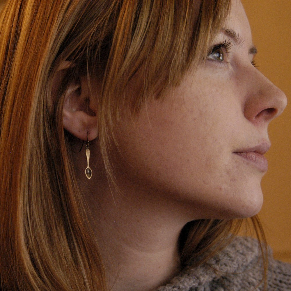 A pair of brass teaspoon dangle earrings.