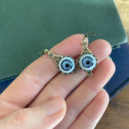 Antiqued brass vintage style blue dolls eye evil eye dangle drop earrings