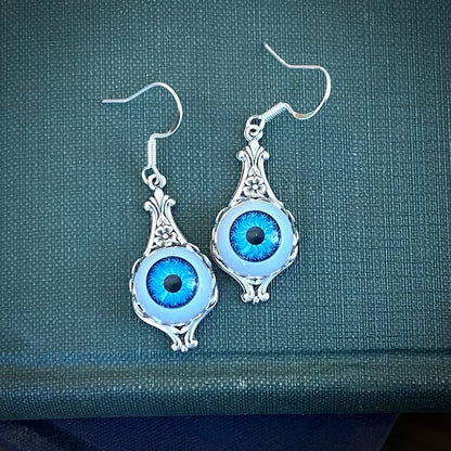 Antiqued silver vintage style light blue dolls eye evil eye dangle drop earrings