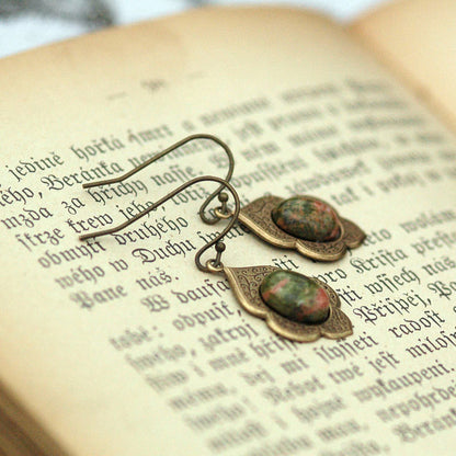 Antiqued brass earrings with unakite cabochons on deco drop settings.