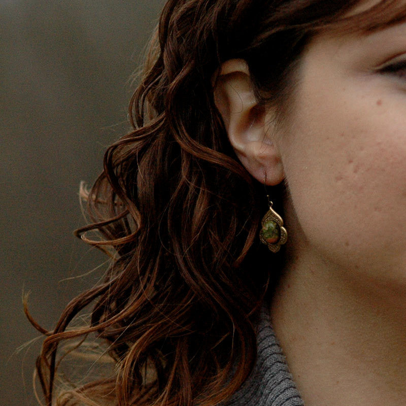 Antiqued brass earrings with unakite cabochons on deco drop settings.