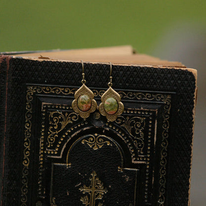 Antiqued brass earrings with unakite cabochons on deco drop settings.
