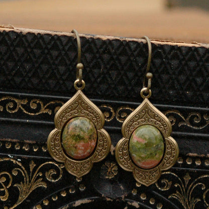 Antiqued brass earrings with unakite cabochons on deco drop settings.