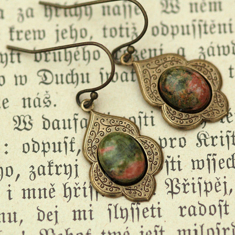 Antiqued brass earrings with unakite cabochons on deco drop settings.