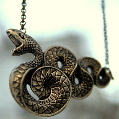 Victorian snake pendant necklace in brass.