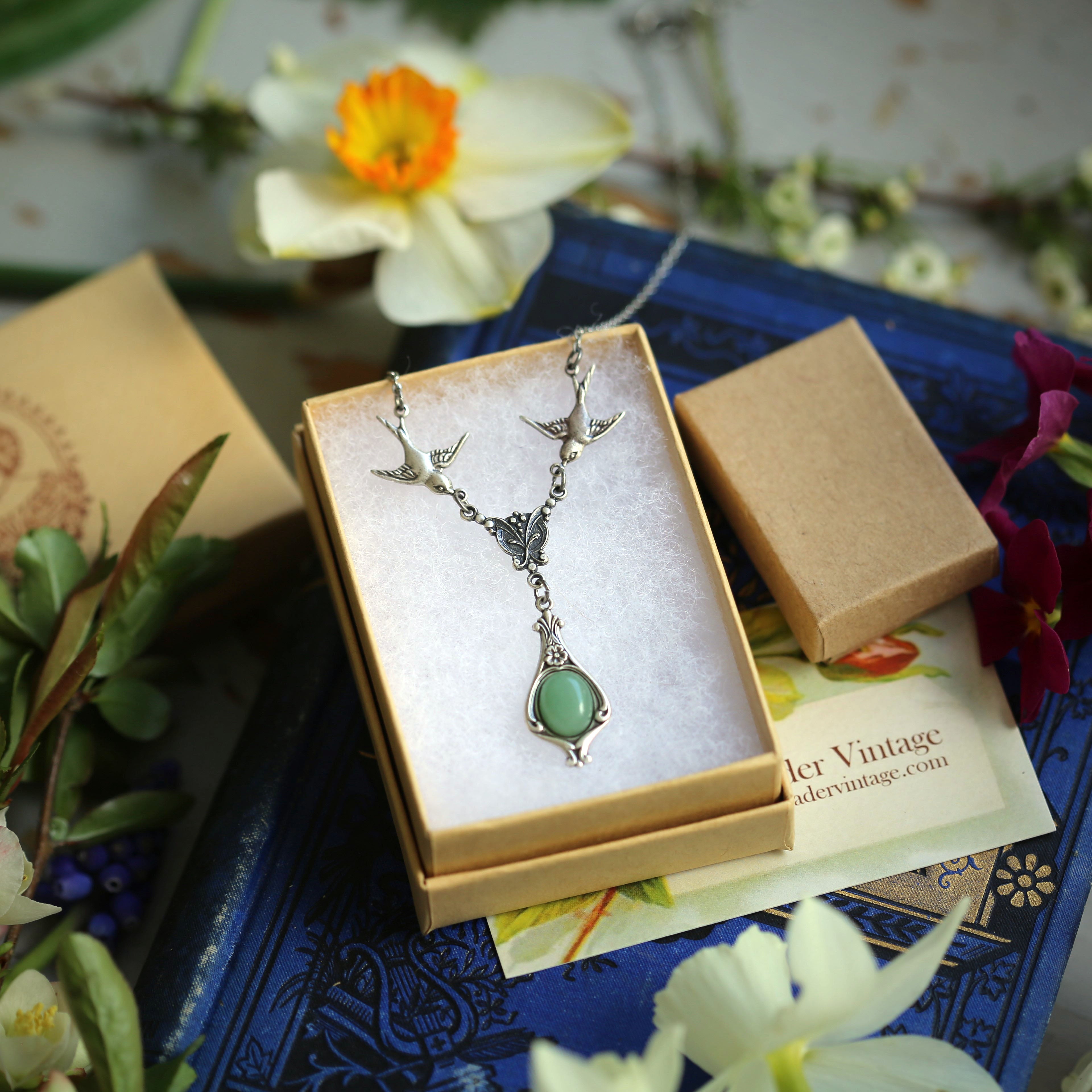 Antiqued silver vintage-style green aventurine drop pendant featuring birds in a light woodland core style.