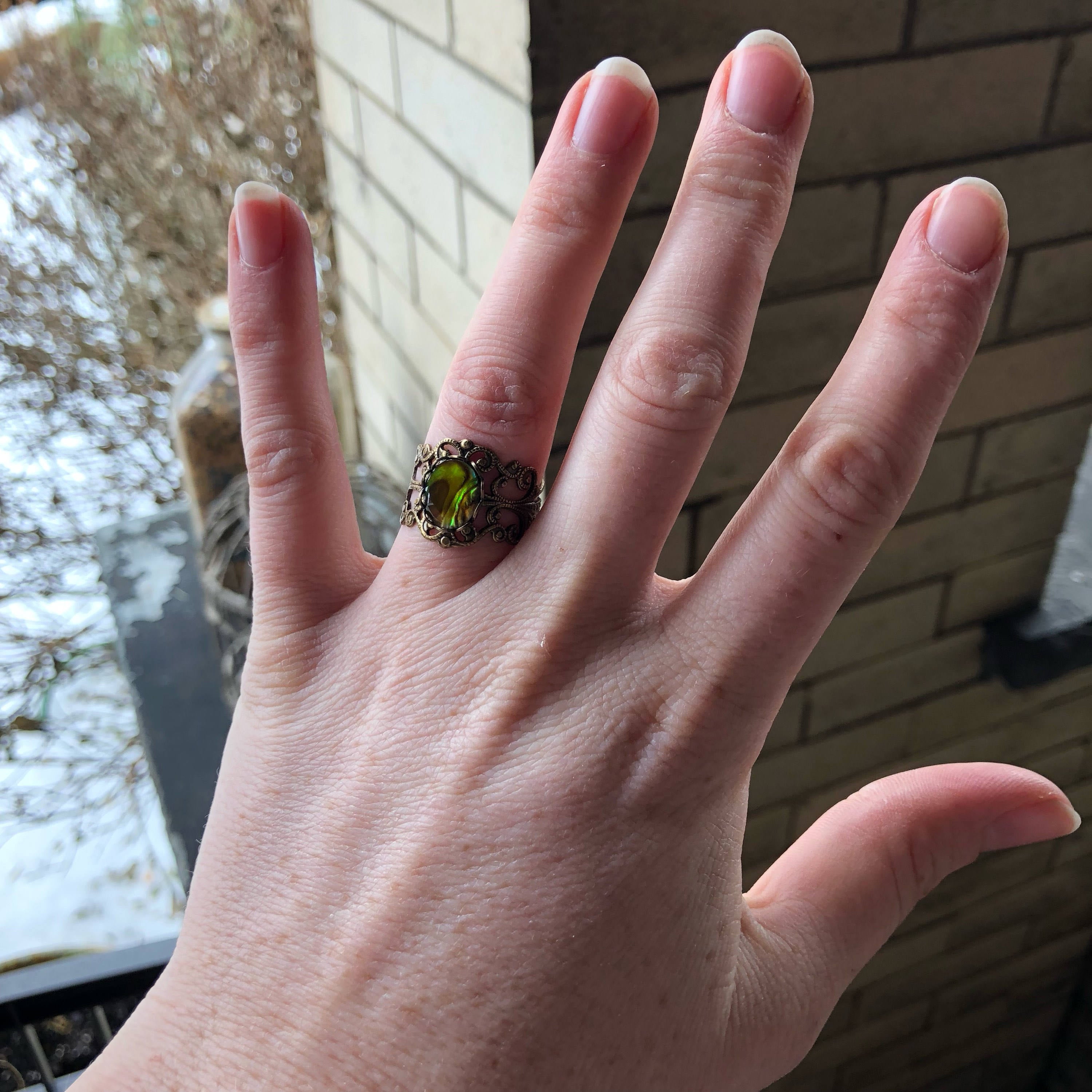 antiqued brass modern vintage inspired fully adjustable yellow green oval shell ring in soft girl aesthetic