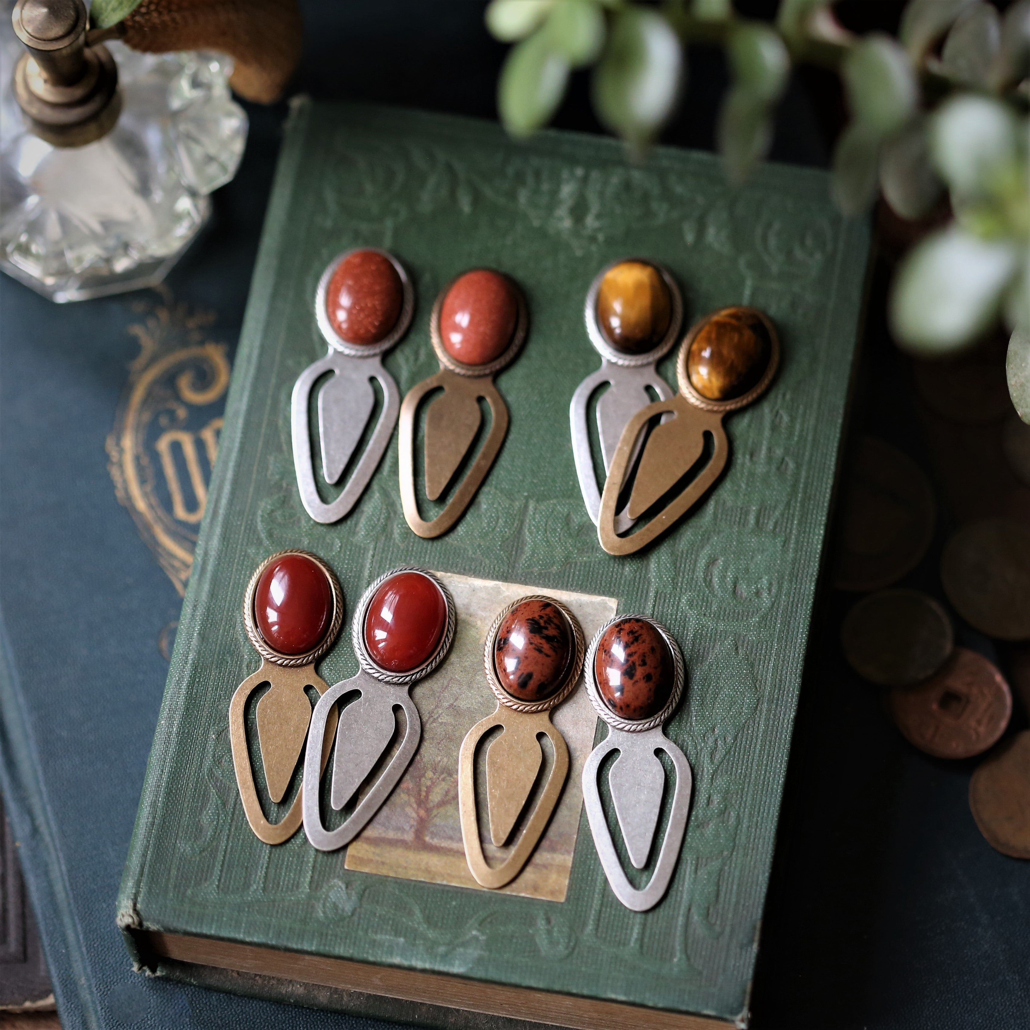 Antiqued brass and silver metal clip bookmarks with oval semi-precious oval stone cabochons in orange and brown mahogany tiger eye carnelian and goldstone autumn academia style gift for book club