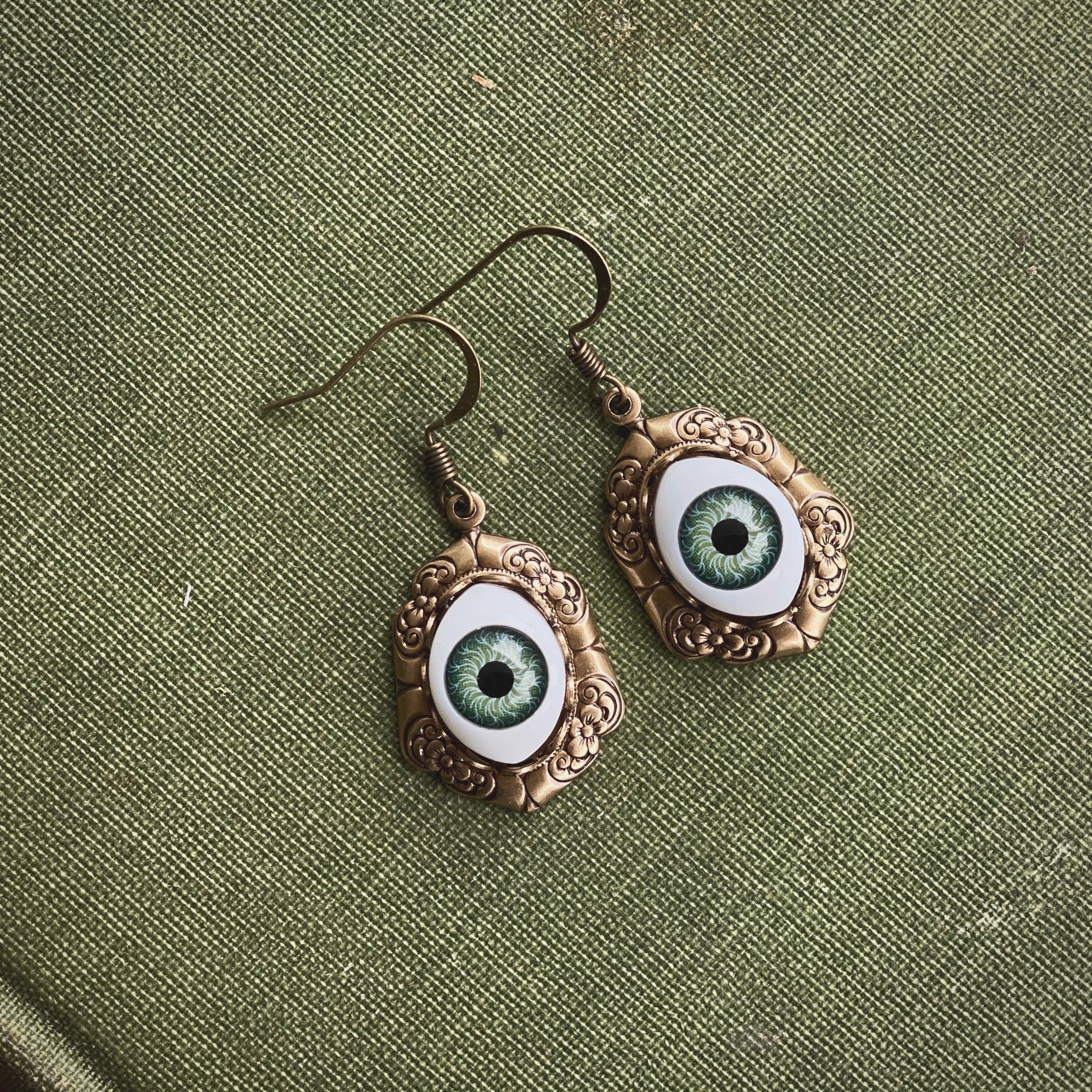 antiqued brass vintage-style oval green dolls evil eye drop dangle earring charms spooky wear