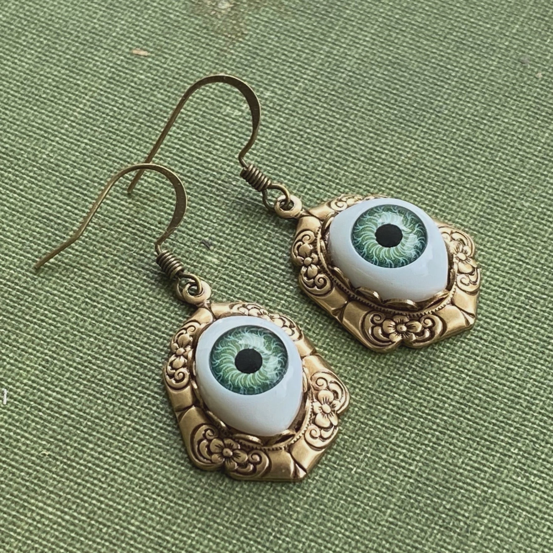 antiqued brass vintage-style oval green dolls evil eye drop dangle earring charms all seeing eye